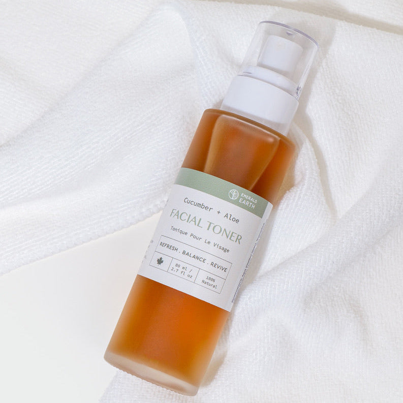 Facial toner bottle with a label on a white towel